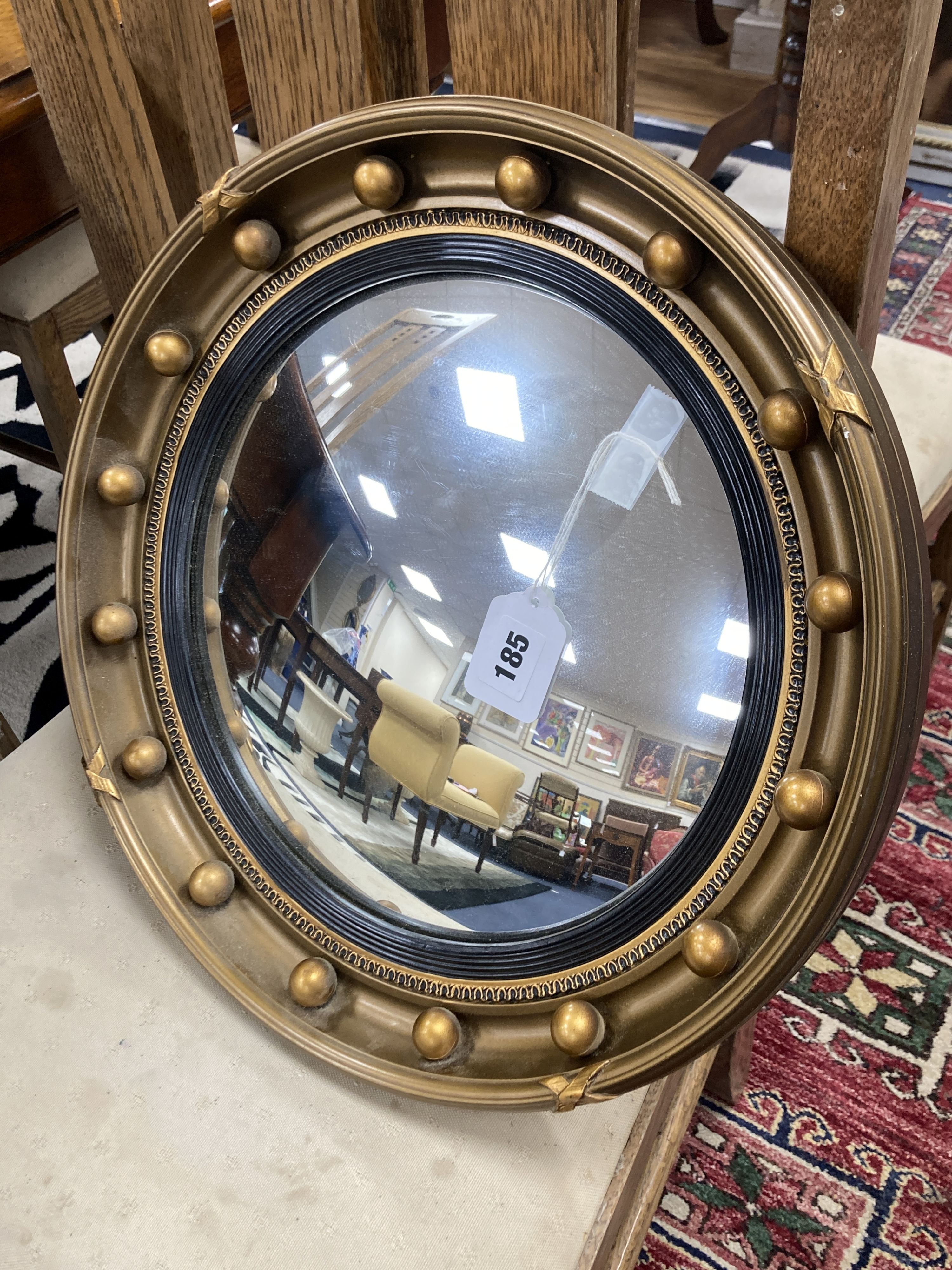 A Regency style convex wall mirror, 41 cm dia.